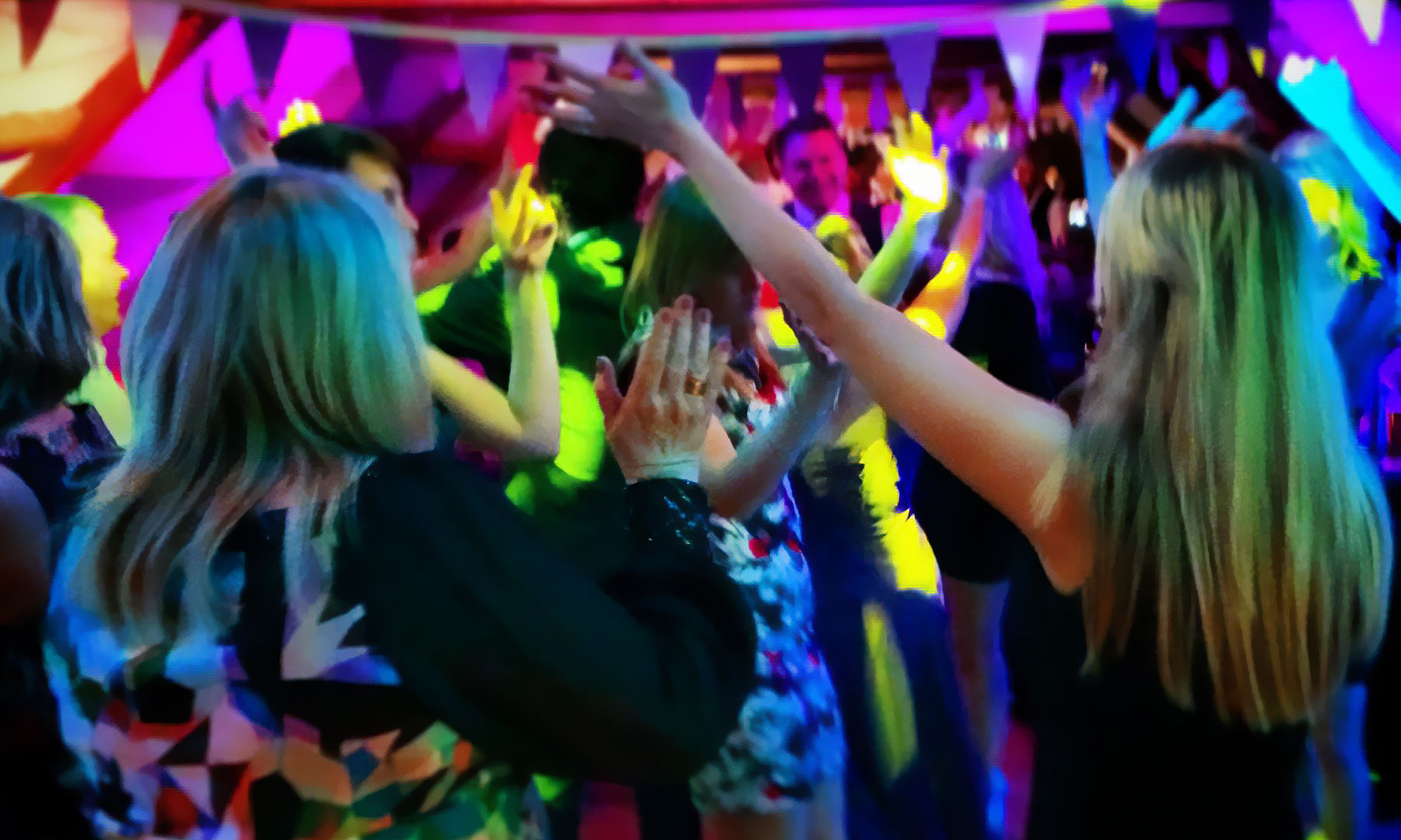 Guests dancing at an evening event